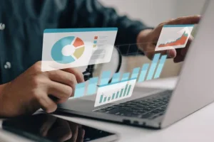 imgi 1 businesspeople working on a monitor graph dashboard while performing statistical and data - Rekomendasi Tools WhatsApp Blast untuk Bisnis Efisien