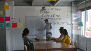imgi 1 cheerful male leader addressing his team during a business meeting at the board room - Cara Mengirim WhatsApp Blast Aman: Panduan Campaign Efektif