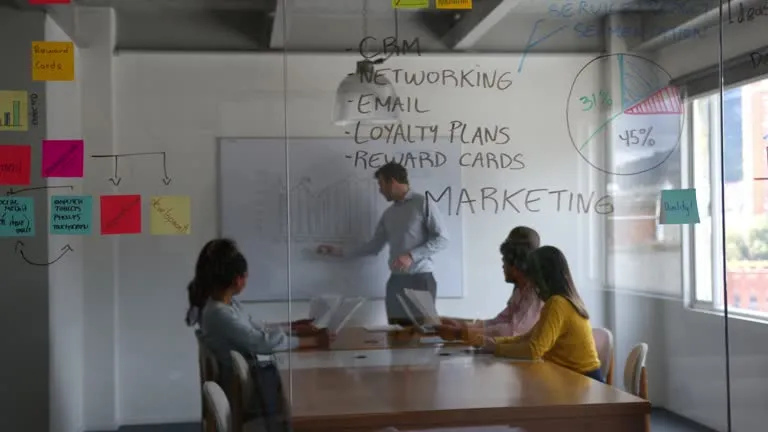 imgi 1 cheerful male leader addressing his team during a business meeting at the board room - Cara Mengirim WhatsApp Blast Aman: Panduan Campaign Efektif